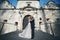 Sensual married couple, valentines hugging in front of old slavic castle