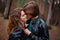 Sensual outdoor portrait of young loving couple kissing