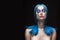 Sensual portrait of beautiful dyed blue hair naked shoulders closed eyes girl wearing necklace. Vanguard fashion make-up.