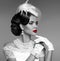 Sensual red lips. Elegant retro woman portrait with fashion jewelry set. Black and white vintage photo.