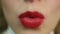 and sensual red lips. Woman blowing air-kiss. Perfect make-up, flirt