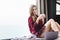 Sensual relaxed woman sitting on the floor and drinking coffee