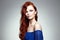 Sensual romantic redhead lady in blue dress