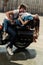 Sensual stylish young couple hugging on motorbike