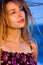 Sensual woman on the beach with hair in wind