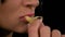 Sensual woman mouth tasting and eating a salty chips