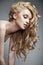 Sensual woman with shiny curly long blond hair