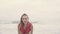 Sensual woman wearing shirt and bikini bottom on a beautiful summer day at the beach