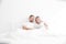 Sensual young couple together in bed. Happy couple in bedroom on a white background.