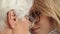 Sentimental forehead touch of young and senior woman. Close up