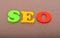 SEO colorful words on wood background