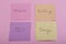 seo concept - colorful sticky notes with words design, website, seo, building on pink background