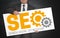 SEO poster is held by businessman