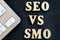 SEO vs SMO and keyboard on a dark desk