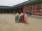 Seoul, South Korea, 29th June 2019: Friends wearing Hanbok at Gyeongbokung palace, fixing clothes