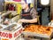 Seoul, South Korea - June 21, 2017: Woman vendor serving customers at Gwangjang Market in Seoul. One of the most popular street