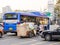 Seoul, South Korea - May 31, 2017: An elderly man carrying the load on a cart, attached to a motorcycle .