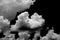 Separate white clouds on a black background have real clouds. White cloud isolated on a black background realistic cloud. white