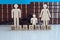 Separation of wooden figure of divorce family with gavel on wooden table in courtroom