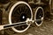 Sepia detail and close up of huge wheels at one old steam locomotive