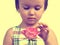 Sepia portrait of cute little girl with rose