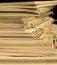 Sepia-style photo of pile of old magazines with bookmarks