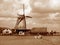 Sepia tone of Dutch Windmill on the Lake Shore of Zaanse Schans