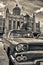 Sepia toned image of classic american parked in front of the Rev