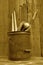 (Sepia) Vintage baseball wood bat, glove, and ball in pail