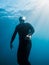 September 10, 2020. Anapa, Russia. Professional freediver in wetsuit with mono fin underwater in sea. Freediving in Black sea