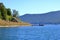 September 13 2023 - Lake Prespa, Albania: Tourists enjoy a boat trip with albanian fishermen