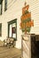 September 15, 2018 - Skagway, AK: Side view of The Red Onion Saloon and public cigarette disposal bin from 2nd Ave.