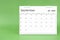 September 2024 desk calendar isolated in green background