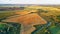 September agriculture fields aerial panorama. Sunny autumn landscape. Corn harvest
