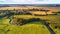 September agriculture fields aerial panorama. Sunny autumn landscape. Farmland Corn harvest