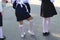 September. beginning of the school year. back view. girl straightens white stockings