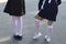 September. beginning of the school year. back view. girl straightens white stockings