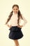 September time to study. Girl cute pupil on white background. Pupil of first grade. School uniform. Back to school