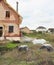 Septic manhole cover and concrete tanks installing in the house construction site