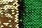 Sequins background Green and gold sequins half background. vibrant macro shimmer texture. shiny fabric. Glitter Material