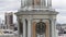 Serbia, Belgrade - July 15, 2022: Top view of clock tower and panorama of modern city. Stock footage. Clock on tower of