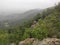 Serbia mountain Jelica forest landscape from from a stone elevation on a foggy day