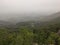 Serbia mountain Jelica forest landscape from from a stone elevation on a foggy day