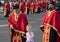 Serbian orthodox priests walking city streets while participating in religious procession