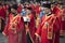 Serbian orthodox priests walking city streets while participating in religious procession