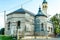 Serbian Ortodox Episcopal Church in Poor Condition Located in Plaski, Croatia. Damaged Building Surrounded by Railings and Grass