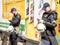 Serbian policemen looking at their smartphones while protecting the 2016 Belgrade Gay Pride wearing anti riot gear in the center