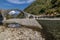 The Serchio River flows under the ancient Ponte della Maddalena, Borgo a Mozzano, Lucca, Italy