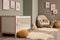 Serene baby room with a cozy crib, playful toys, soft carpet, and rustic basket