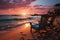 Serene beachscape adorned with loungers, umbrella, and a colorful sunset sky